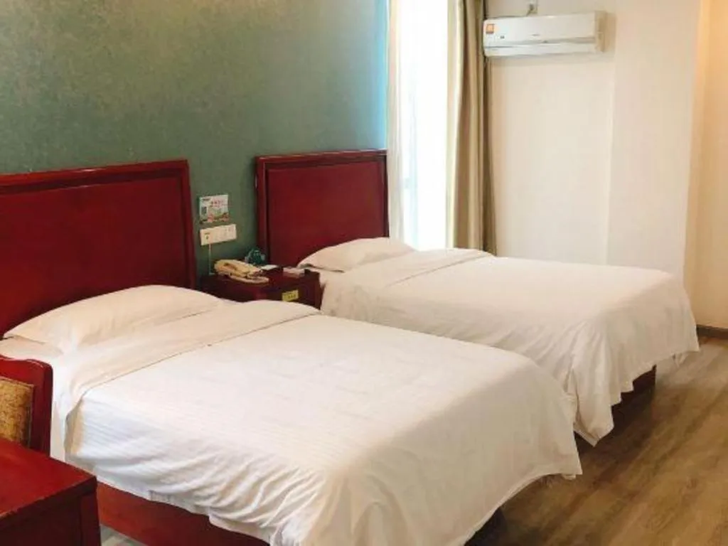 Bed in GreenTree Inn Suzhou Shengze Hotel