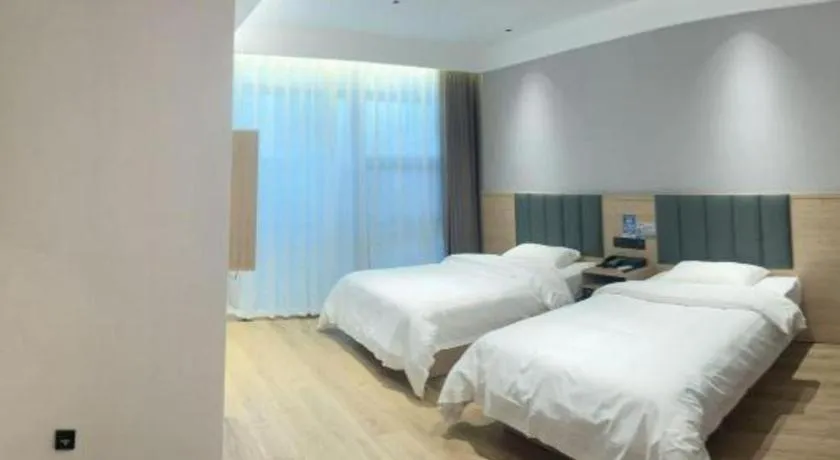 Bed in GreenTree Inn Suzhou Shengze Hotel