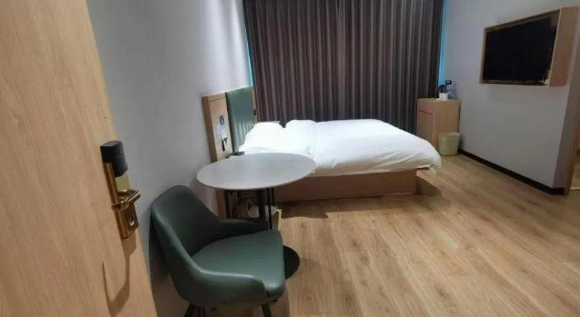 Bed in GreenTree Inn Suzhou Shengze Hotel