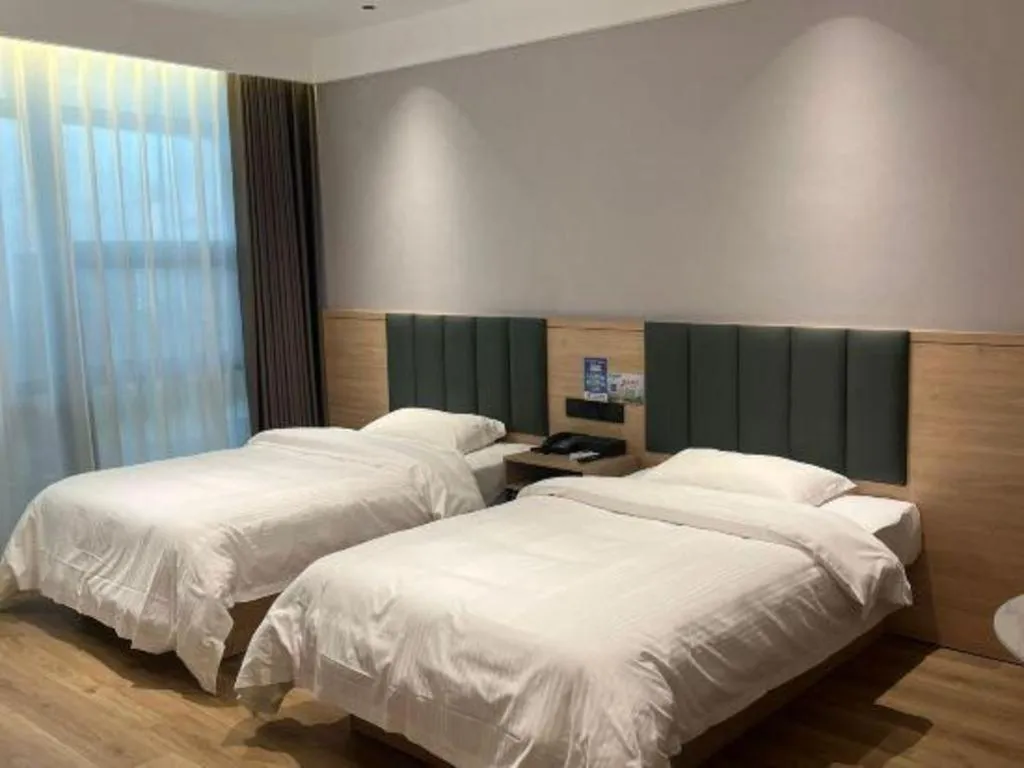 Bed in GreenTree Inn Suzhou Shengze Hotel