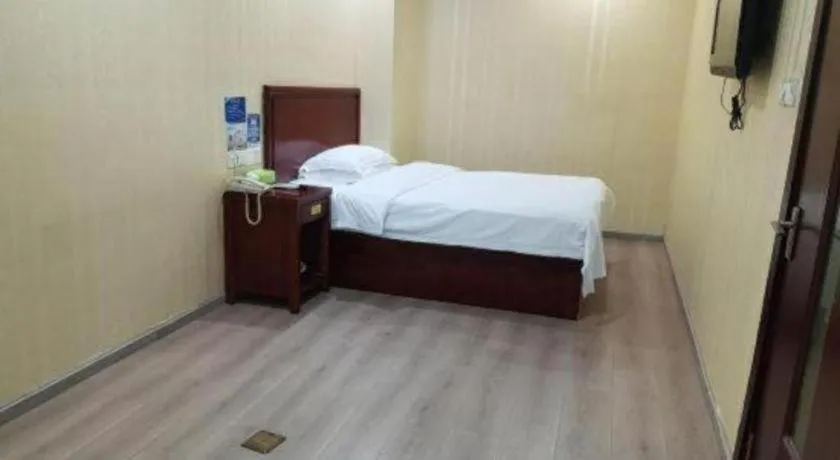 Bed in GreenTree Inn Suzhou Shengze Hotel