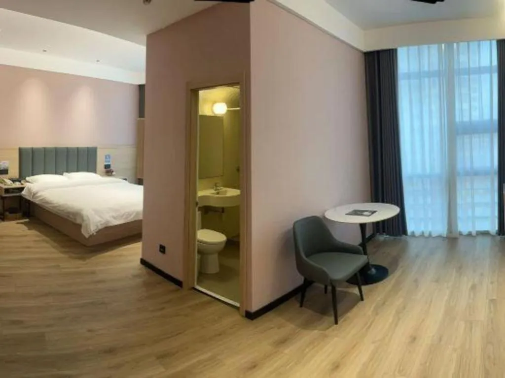 Bed in GreenTree Inn Suzhou Shengze Hotel