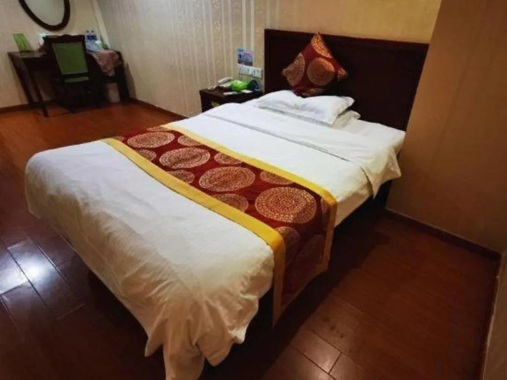 Bed in GreenTree Inn Suzhou Shengze Hotel