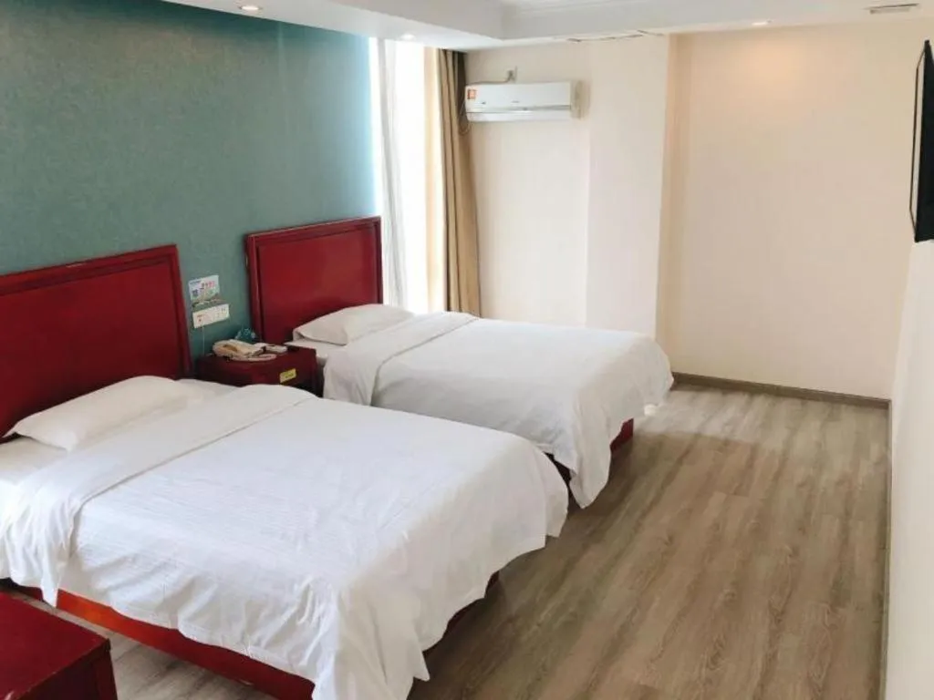 Bed in GreenTree Inn Suzhou Shengze Hotel