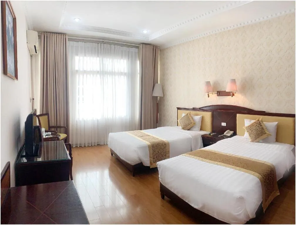 Bed in Cong Doan Viet Nam Hotel