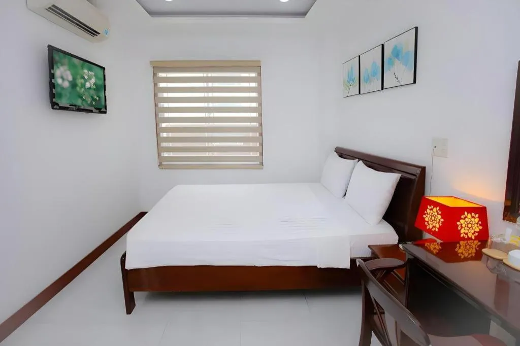 Bed in Nhatrang Cozy Hotel