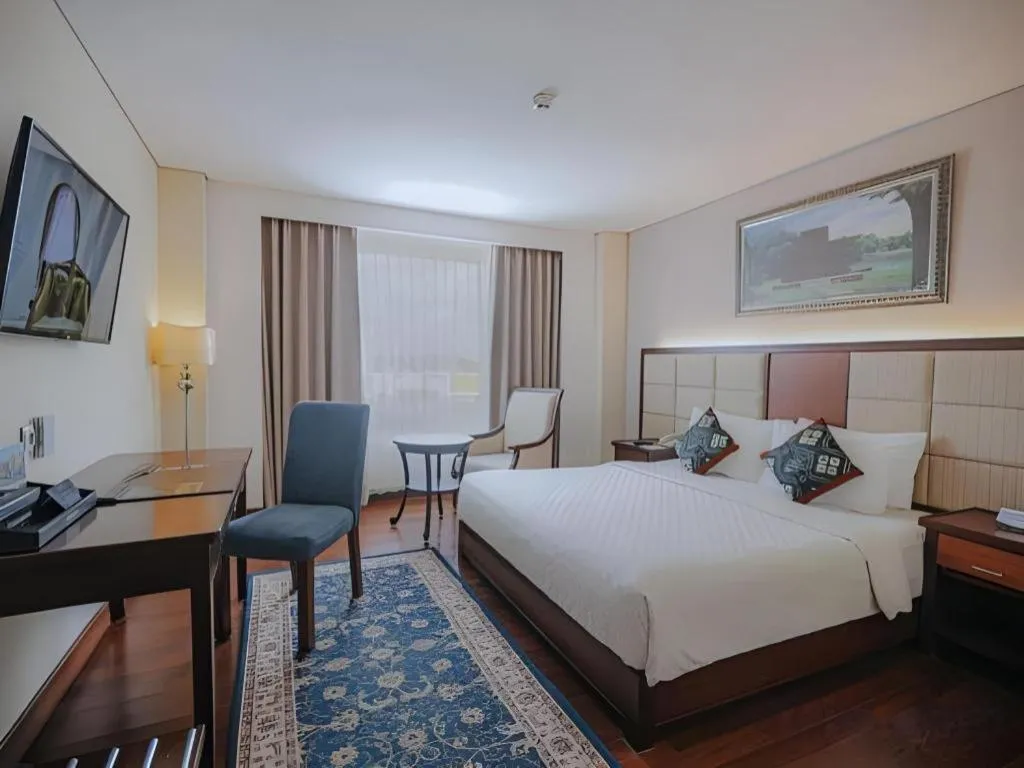 Bed in Grand Qin Hotel Syariah