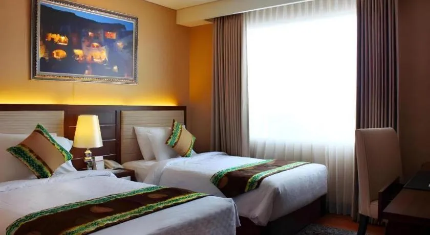 Bed in Grand Qin Hotel Syariah