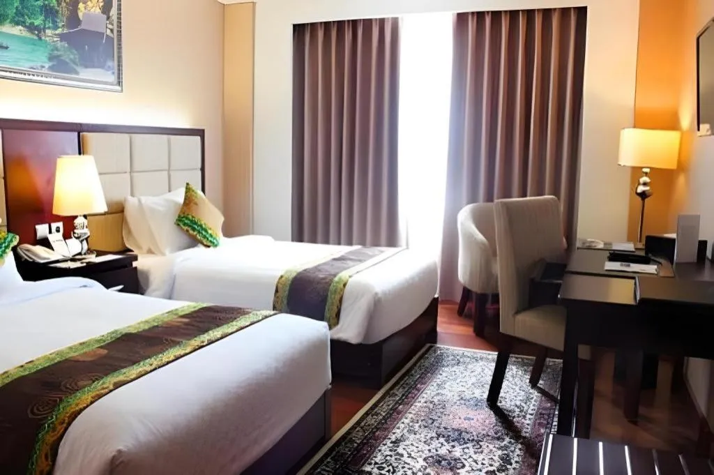 Bed in Grand Qin Hotel Syariah