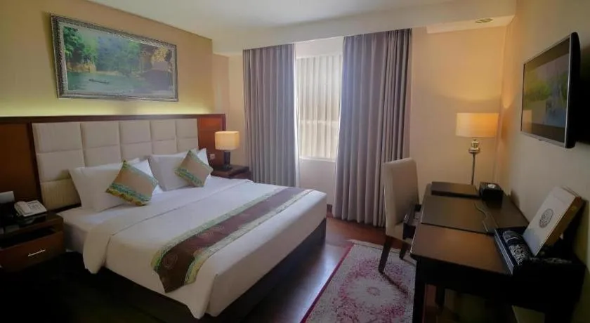 Bed in Grand Qin Hotel Syariah