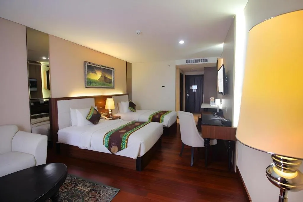 Bed in Grand Qin Hotel Syariah