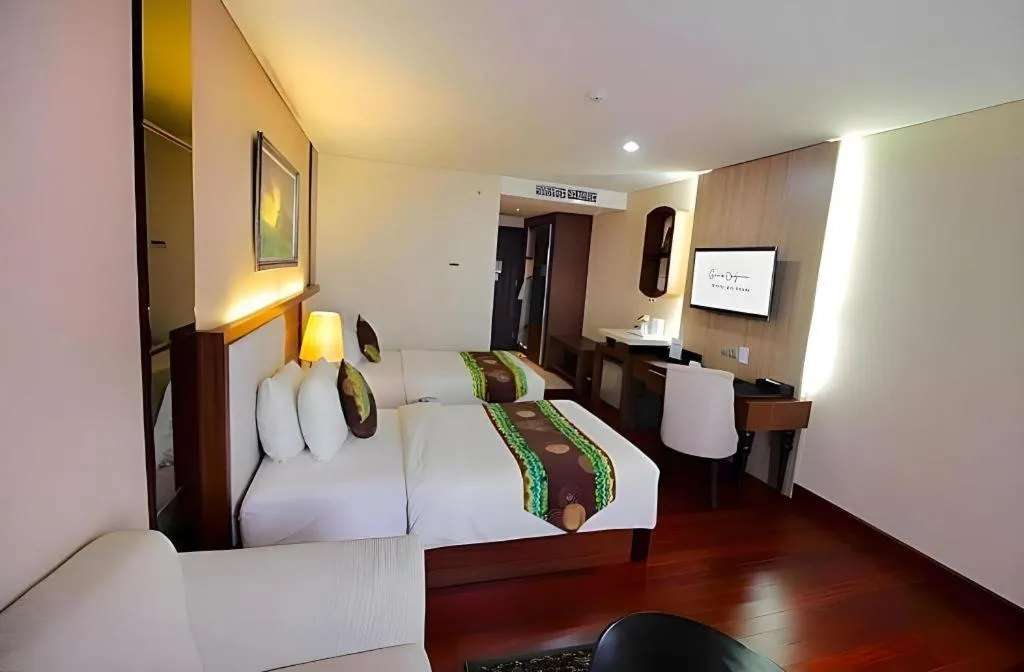 Bed in Grand Qin Hotel Syariah