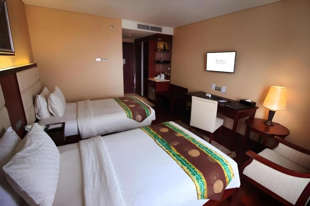 Bed in Grand Qin Hotel Syariah