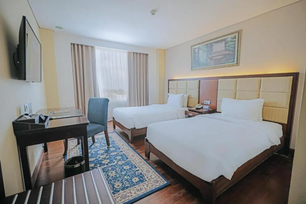 Bed in Grand Qin Hotel Syariah