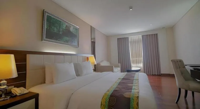 Bed in Grand Qin Hotel Syariah