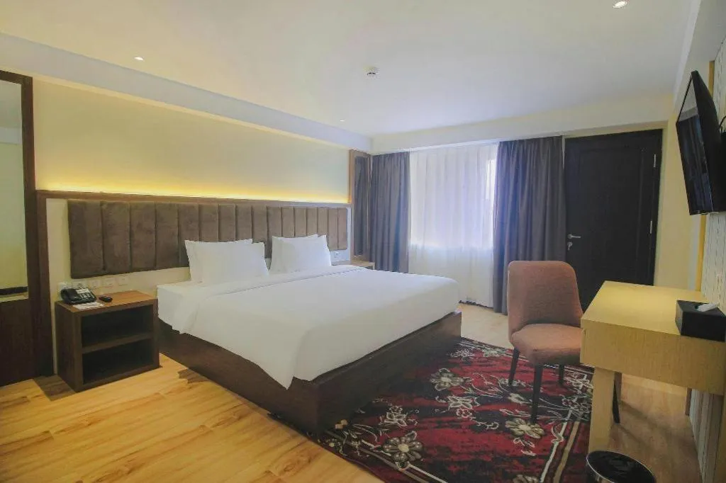 Bed in Grand Qin Hotel Syariah
