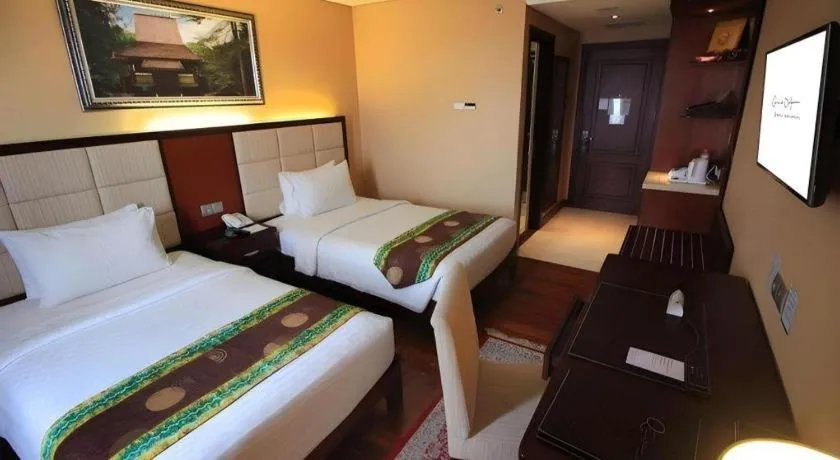 Bed in Grand Qin Hotel Syariah