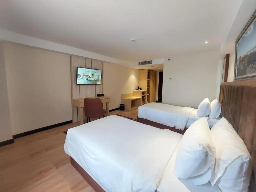 Bed in Grand Qin Hotel Syariah