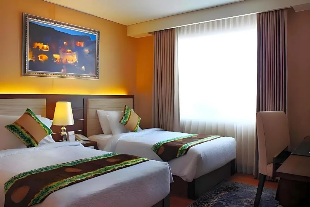 Bed in Grand Qin Hotel Syariah