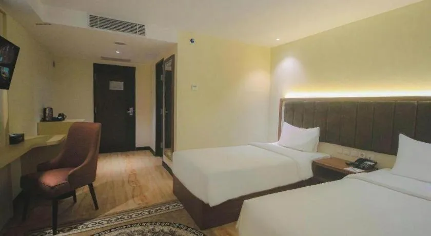 Bed in Grand Qin Hotel Syariah