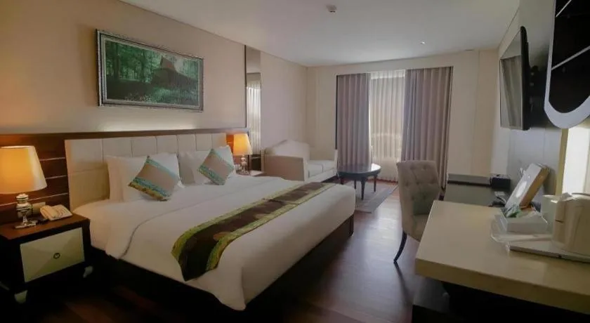 Bed in Grand Qin Hotel Syariah