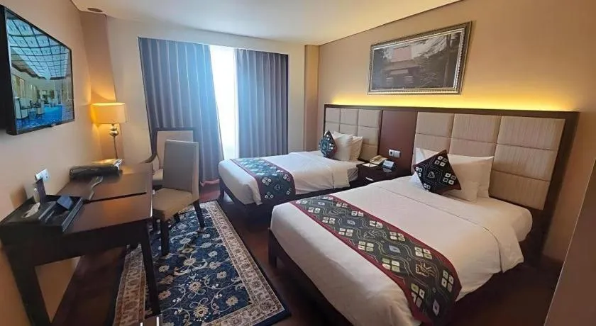 Bed in Grand Qin Hotel Syariah
