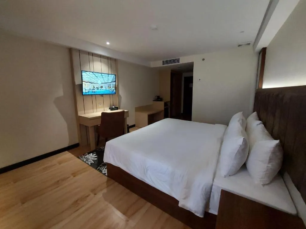 Bed in Grand Qin Hotel Syariah