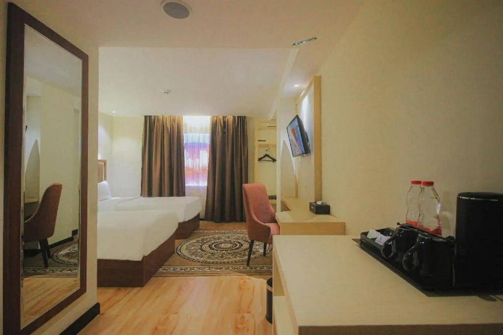 Bed in Grand Qin Hotel Syariah