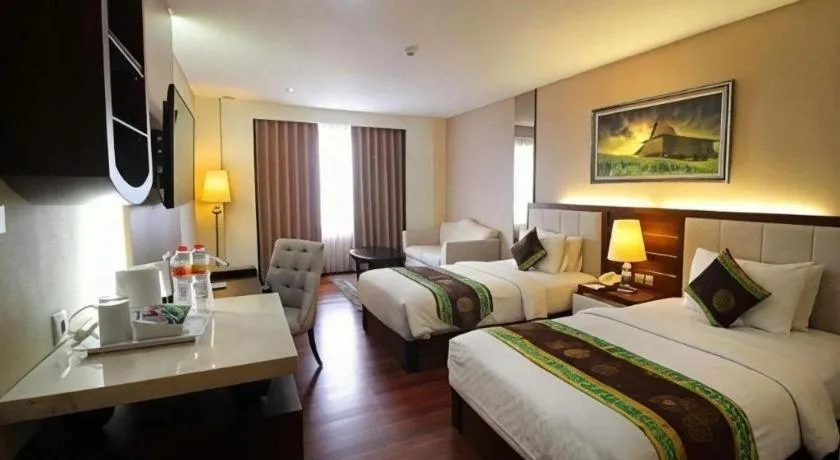 Bed in Grand Qin Hotel Syariah