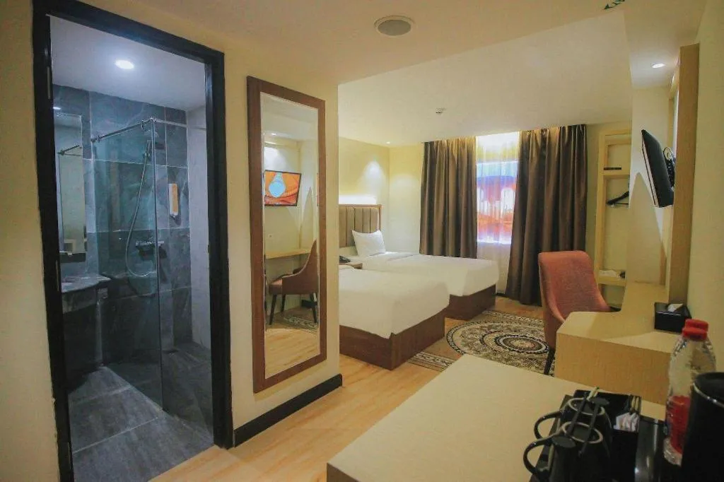 Bed in Grand Qin Hotel Syariah