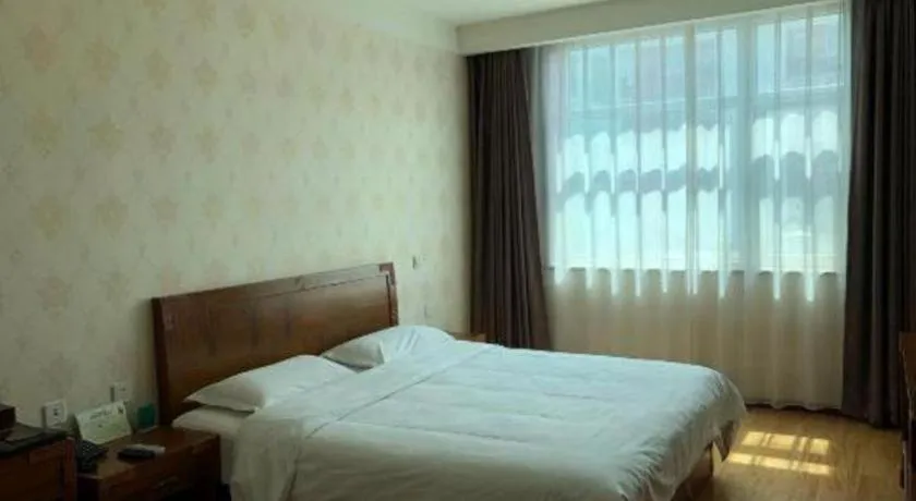 Bed in Beijing Wanjia Traders Hotel