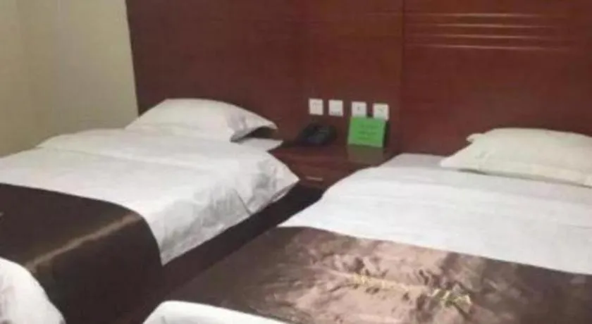 Bed in Beijing Wanjia Traders Hotel