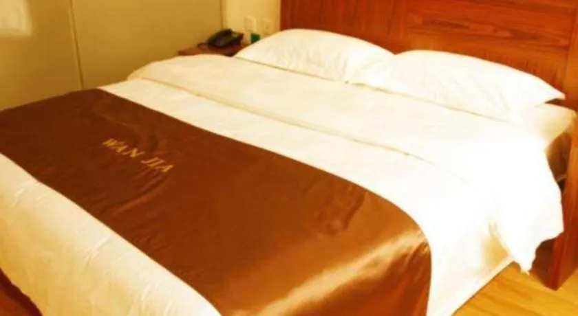 Bed in Beijing Wanjia Traders Hotel
