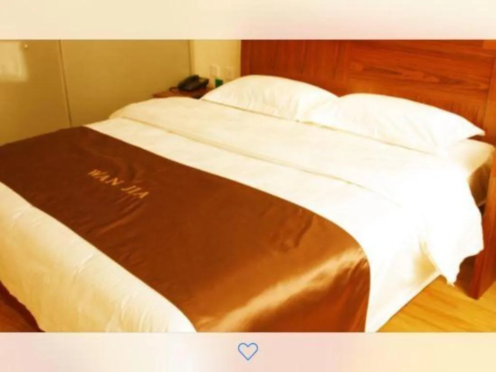 Bed in Beijing Wanjia Traders Hotel