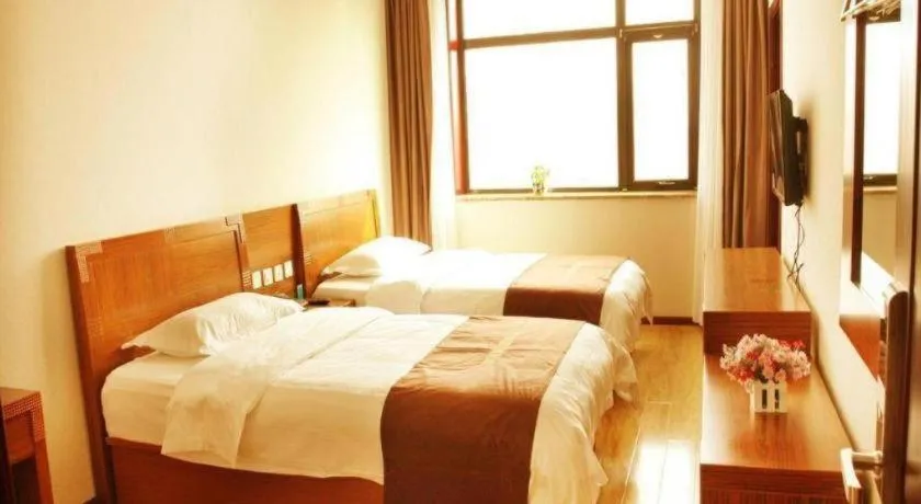 Bed in Beijing Wanjia Traders Hotel