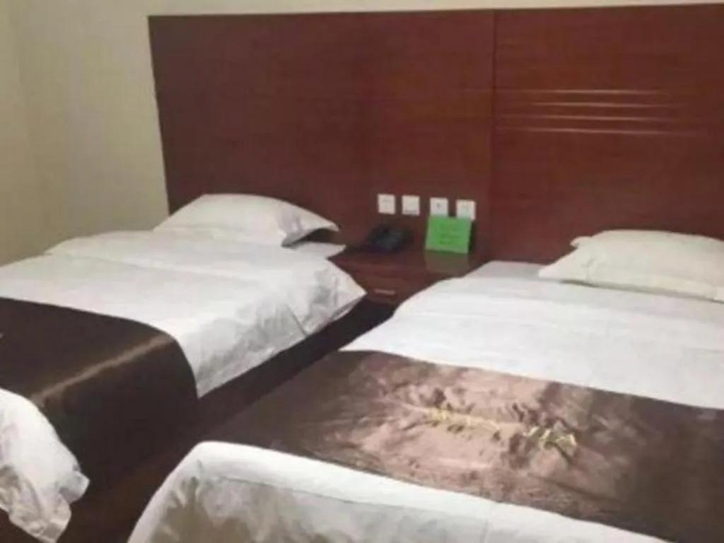 Bed in Beijing Wanjia Traders Hotel
