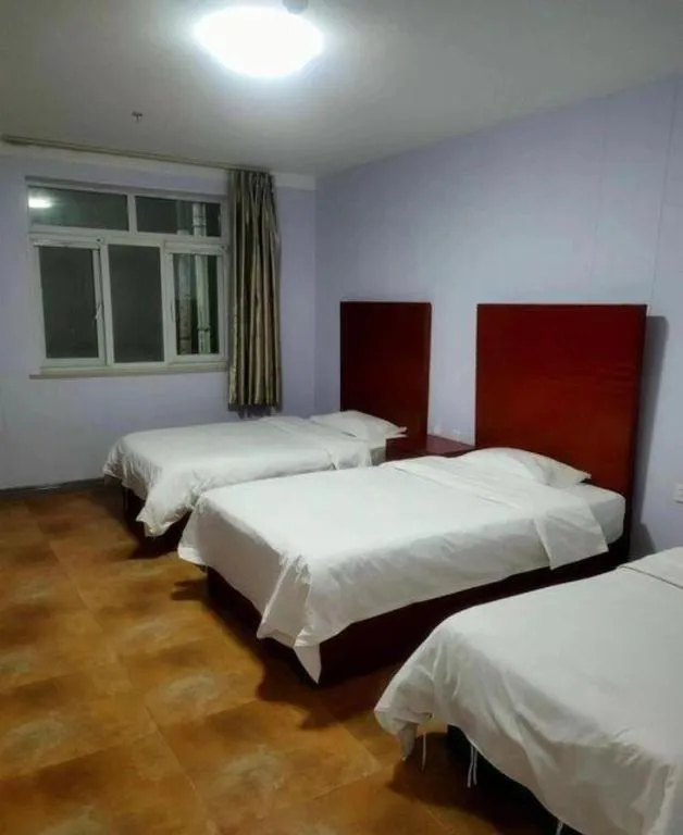 Bed in Beijing Wanjia Traders Hotel