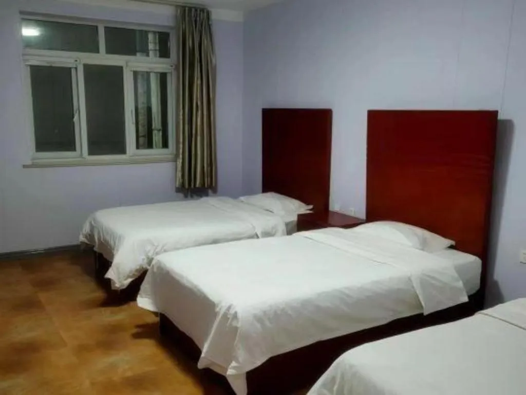 Bed in Beijing Wanjia Traders Hotel