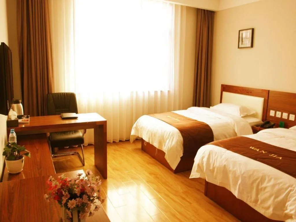 Bed in Beijing Wanjia Traders Hotel