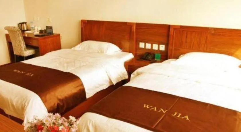Bed in Beijing Wanjia Traders Hotel