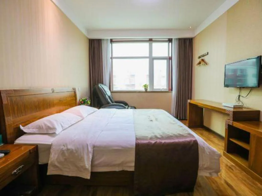 Bed in Beijing Wanjia Traders Hotel