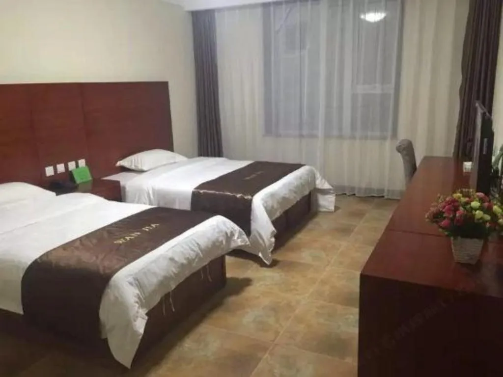 Bed in Beijing Wanjia Traders Hotel
