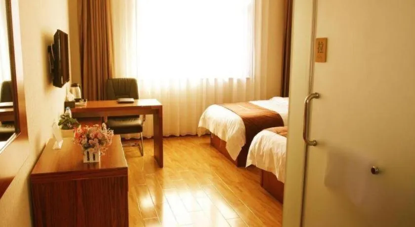 Bed in Beijing Wanjia Traders Hotel