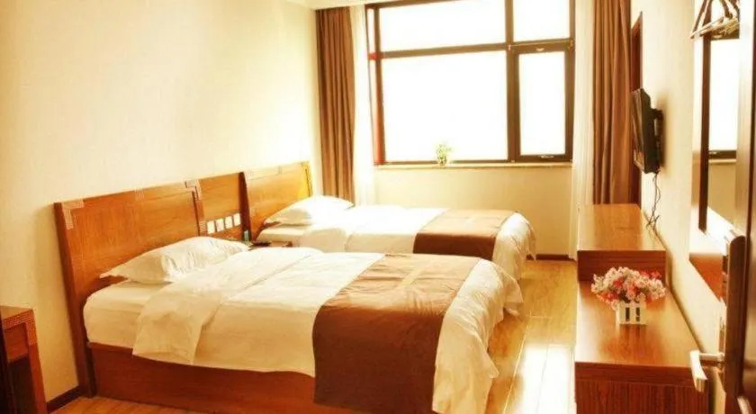 Bed in Beijing Wanjia Traders Hotel