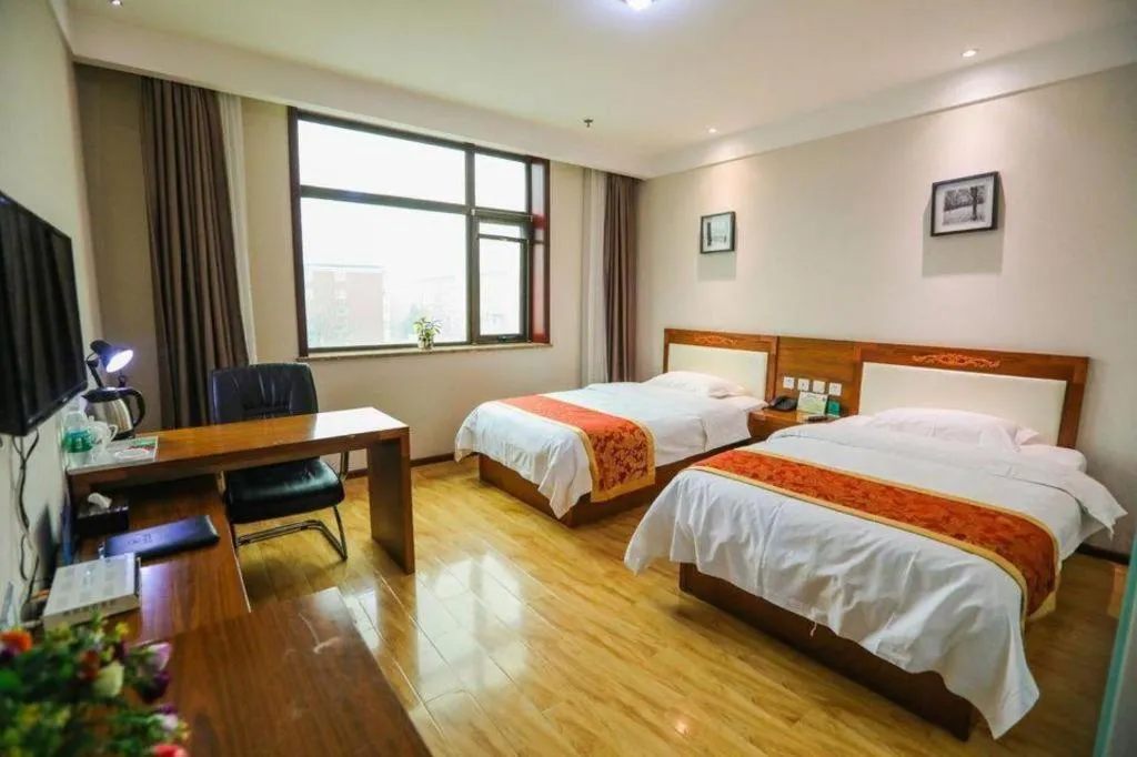 Bed in Beijing Wanjia Traders Hotel