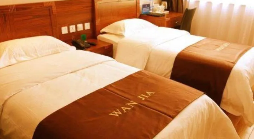 Bed in Beijing Wanjia Traders Hotel