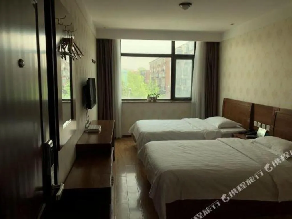 Bed in Beijing Wanjia Traders Hotel