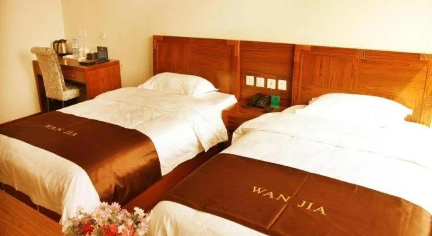 Bed in Beijing Wanjia Traders Hotel