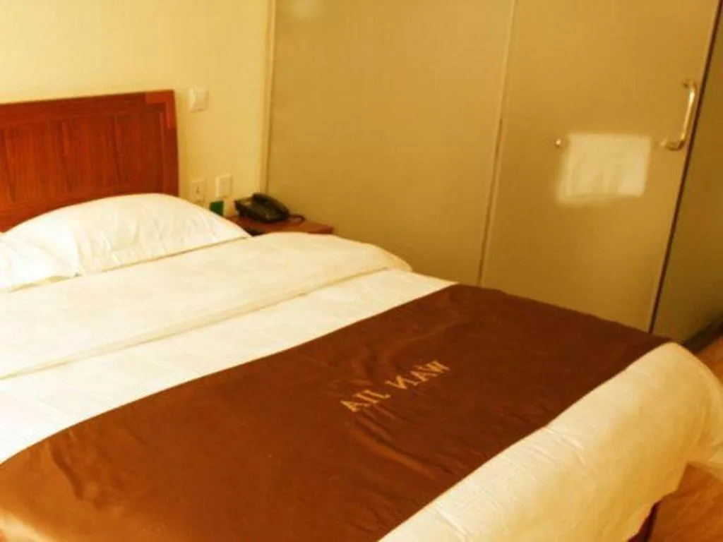 Bed in Beijing Wanjia Traders Hotel