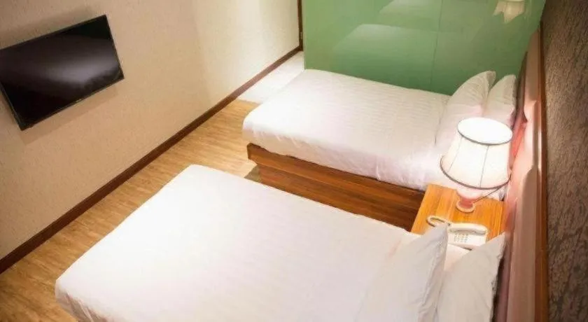 Bed in Metro Winner Hotel